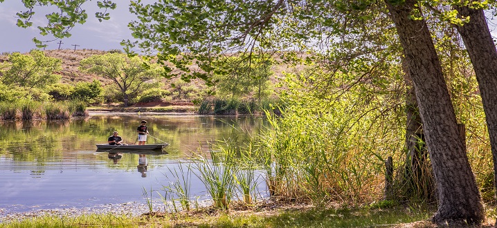 picture of guest fishing in the spring feed pond