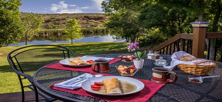 picture of breakfast on private balcony over looking the pond