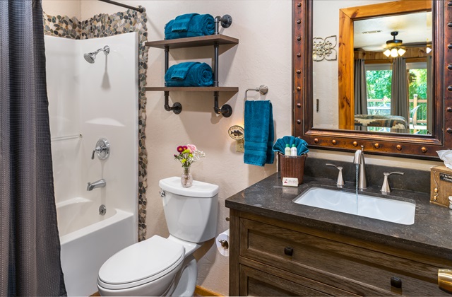 Gone Fishin room private bathroom with tub and shower